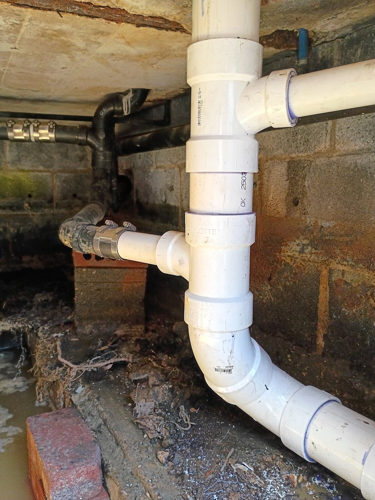 New PVC sewer line, drain stack, and venting installed in a crawl space replacing a failed terracotta system in Upper Pittsgrove, NJ