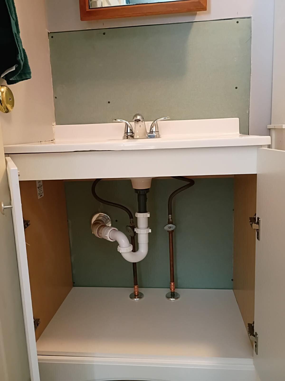 New under-sink supply lines and P-trap install at a bathroom vanity in Toms River, NJ